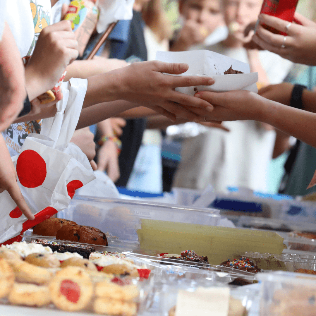 Close up image of people being served food depicting community events in the Rural Municipality of Reynolds.