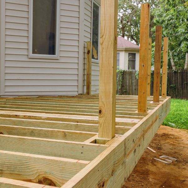 April Newsletter Before You Build Image of a new deck being framed out.